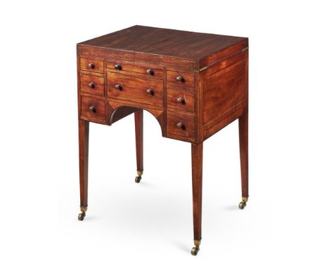 A George III mahogany and ebony strung dressing table, late 18th century, of campaign type, the hinged top enclosing the fitt