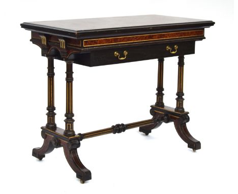 A Victorian Aesthetic movement card table by Gillows of Lancaster, c.1880, amboyna, ebonised and parcel gilt with fold over b