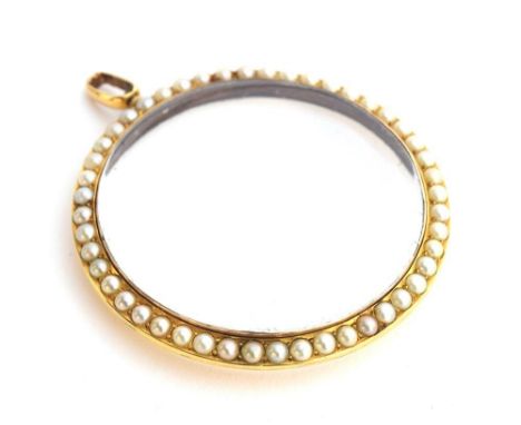 A yellow metal and split pearl double sided photo locket, 5cm diameter 