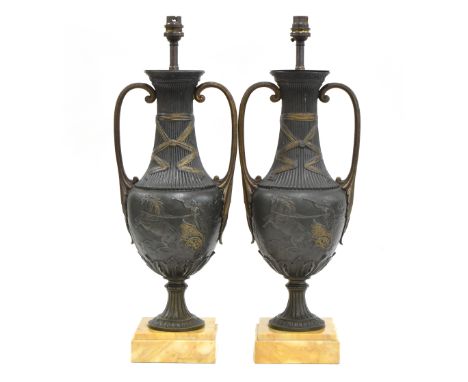 A pair of spelter figural table lamps, with shades, 31cm high to top of fitting