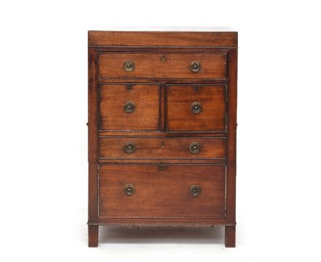 A George III mahogany night commode, late 18th/ early 19th century and later, the hinged top above drawers and doors, 51cm wi