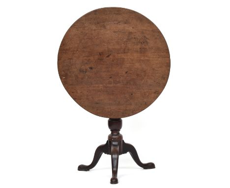 A George III mahogany circular tripod table, top top birdcage action, on turned column and cabriole legs with pad feet, 73cm 
