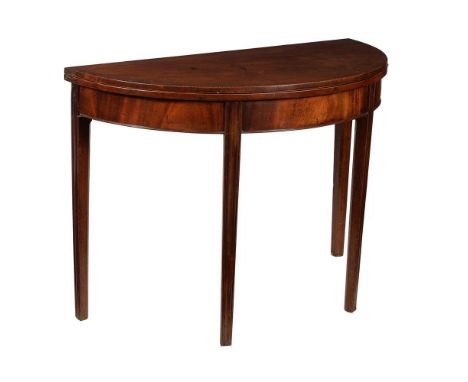 A George III mahogany and inlaid folding tea table, circa 1800, 74cm high, 99cm wide, 49cm deep 