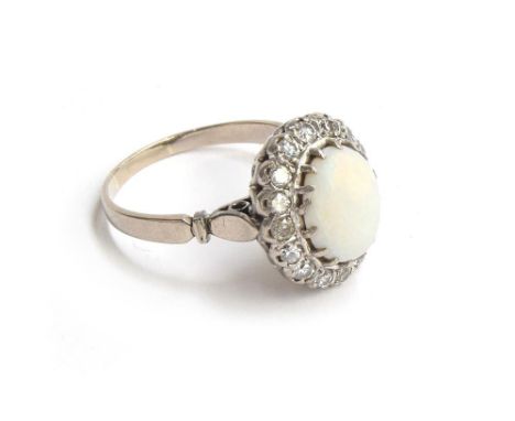 A diamond and opal cabochon ring mounted in white metal, size W, approx. 7g 