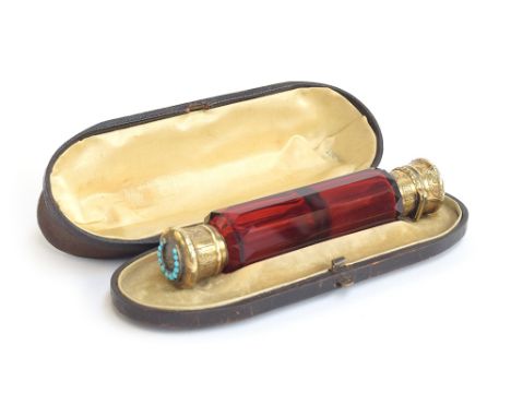 A 19th century Morden &amp; Co. double ended scent and smelling salts bottle, faceted ruby glass, with silver gilt hinged and