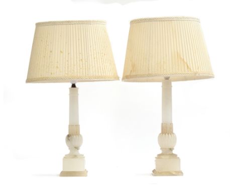 A near pair of Italian turned alabaster table lamps, capped column on square plinths, 42.5cm high to the top of fittingProven