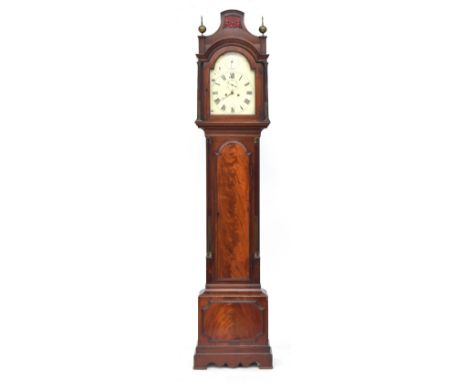 A mahogany longcase clock, the pediment with red silk backed blind fretwork, above a domed enamel dial with Roman numerals, f