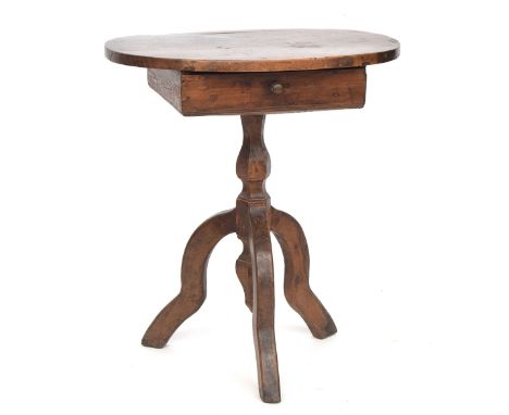 A naive Continental occasional table, oval top over single drawer, on faceted column support with tripod legs, 62cm wide, 44c