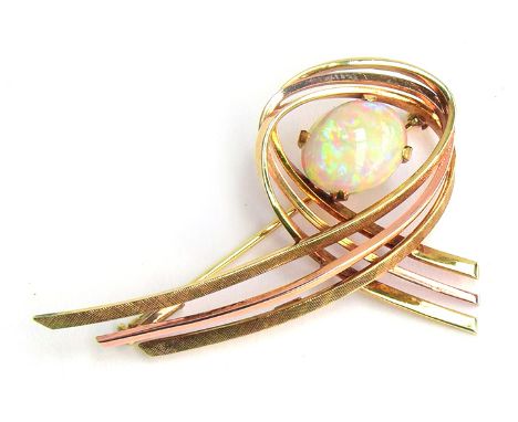 A 14ct gold modernist brooch set with a large opal cabochon, approx. 7.4g, 5cm wide