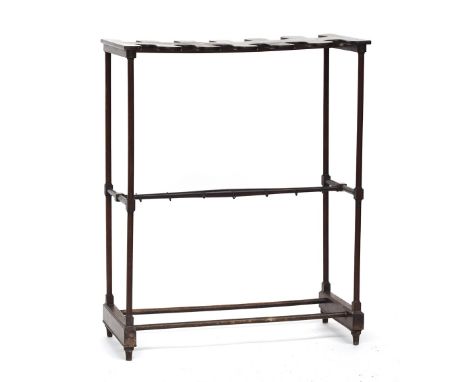 A Victorian mahogany boot and whip stand c. 1840, having twelve recesses, the mid-rail with hooks, 69cm wide, 33cm deep, 85cm