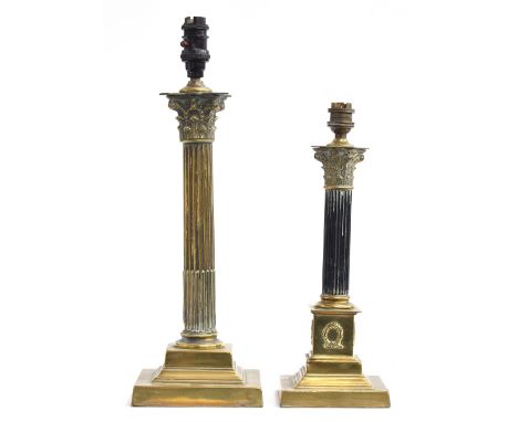 Two corinthian column table lamps, the shorter with reeded ebonised column, each on square stepped base, 30cm and 38cm high t