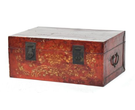 A Chinese lacquered and parcel gilt trunk, with iron carry handles and fittings, 79cm wide, 52cm deep, 33cm highProvenance: p