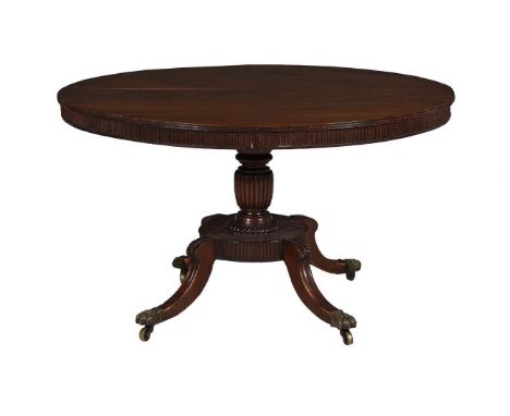 A George IV mahogany centre table, circa 1825, the circular top with reeded edge and frieze, 73cm high, 121cm diameter 