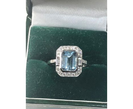 Fine diamond and Aquamarine ring large central aqua is 2.28 ct with diamonds around set in platinum 