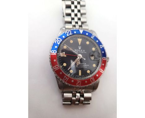 Beautiful and all parts original Vintage Rolex GMT Pepsi mark II, circa 1964. A stainless steel automatic calendar bracelet w