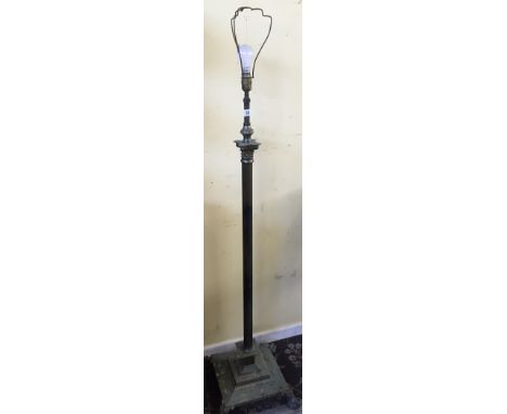 A floor standing brass Corinthian Column standard lamp.
