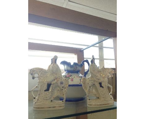 A pair of late 19th century Staffordshire flat back figures modelled as Soldiers on Horseback together with a china jug and b
