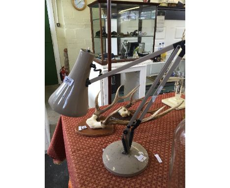 A grey painted angle poise lamp.
