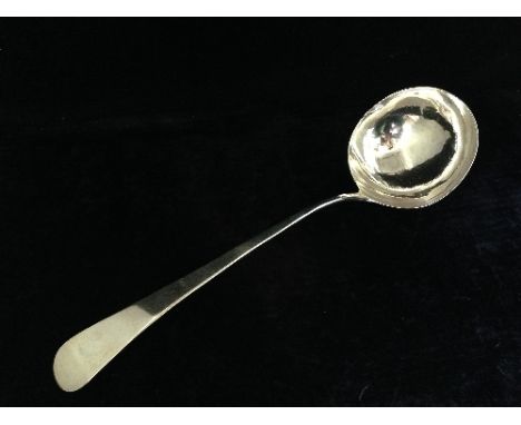 A large silver ladle, possibly 18th century, marks worn.