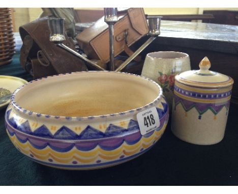 A red bodied Poole Pottery Carter Stabler Adams fruit bowl, decorated in the QO pattern together with a jam pot, decorated in