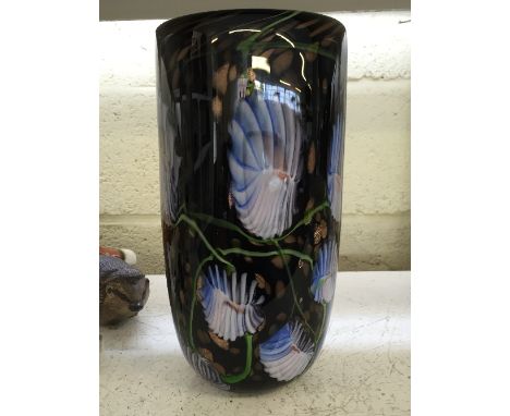 A heavy multi coloured Art Glass vase.