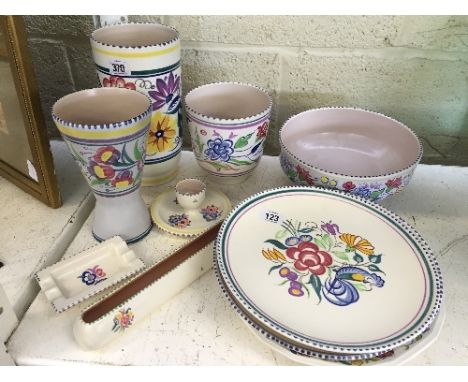 A large quantity of white bodied Poole Pottery.