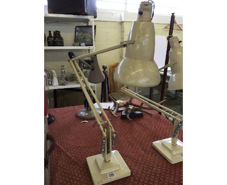 A cream painted Herbert Terry & Sons stepped base angle poise desk lamp.
