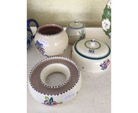 Four various Poole Pottery items including a muffin dish, decorated in the WW pattern, jam pot, circular posy ring and CSA va