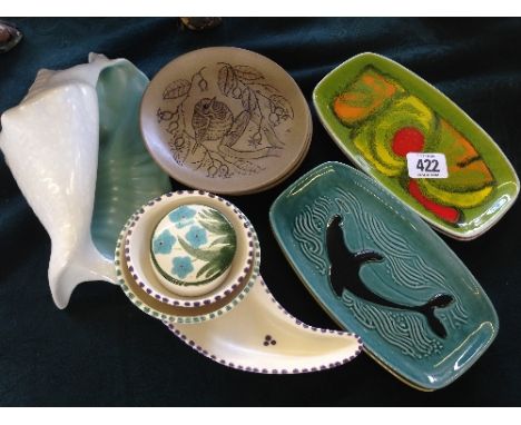 A collection of thirteen various Poole Pottery items including two Delphis pin trays, shape 361.
