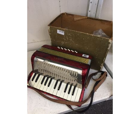 A small Hohner Mignon Mk II accordion.