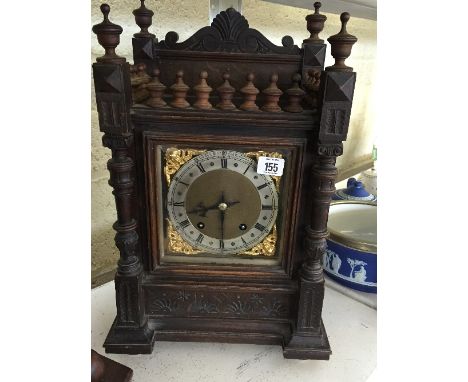 A late 19th century Marsh & Co., Birmingham carved oak cased mantle clock (replaced movement).