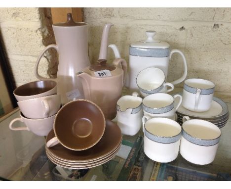 A Royal Doulton bone china coffee set decorated in the Etude pattern together with the residue of a Poole Pottery Twin Tone c