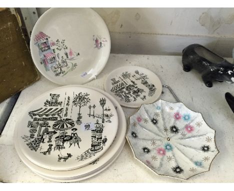 An Alfred Meakin china plate, decorated in the Montmartre pattern together with seven similar plates, decorated in the Parisi