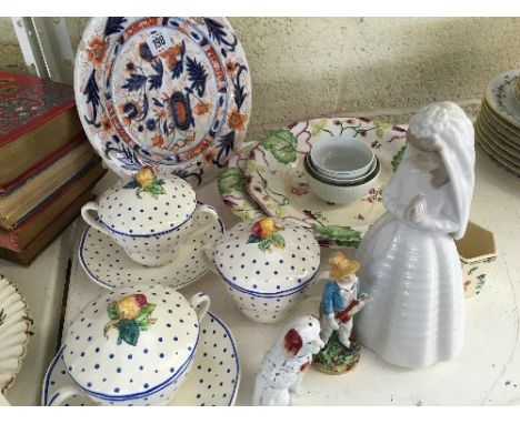 A shelf containing a quantity of various late 19th century and other china.