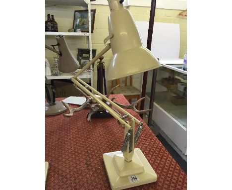 A cream painted Herbert Terry & Sons stepped base angle poise desk lamp.