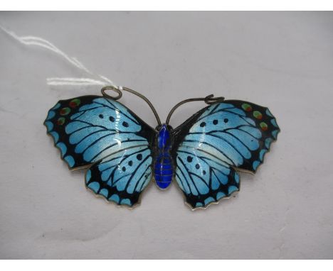Silver and Enamel Butterfly Brooch with Pale Blue and Black Wings with Red/Green Spots and Deep Blue Enamel Body, by J. Atkin