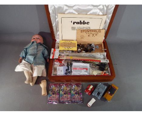 Mixed lot to include a composition head doll, model boat accessories, a small quantity of diecast to include a Corgi Whizz Wh