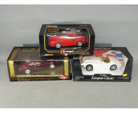 Bburago, Guilloy, Ertl - Three boxed diecast model cars in 1:18 scale. Lot consists of Bburgao #3050 Porsch 911 Carrera; Ertl