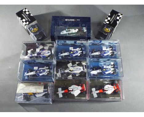 Minichamps - A collection of 10 1:43 scale diecast model F1 racing cars and 2 boxed 1:8 scale Racing Helmets by Minichamps. L