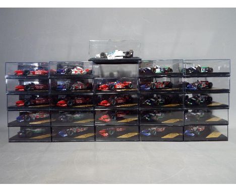 Onyx - 24 diecast model F1 cars by Onyx, contained in original display boxes.