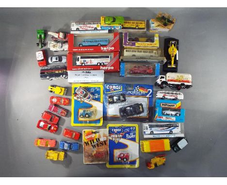 Matchbox, Herpa, Corgi, Efsi and Others - A collection of over 30 boxed and unboxed diecast model vehicles in various scales.