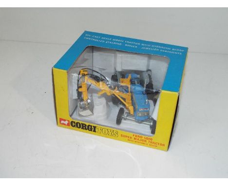 Corgi - a diecast model Ford 5000 Super Major Tractor with Hydraulic Scoop and driver figure  # 74 appears mint in original w