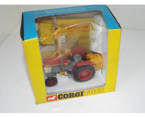 Corgi - a diecast model Massey-Ferguson Tractor 165 with Saw attachment # 73 appears mint in original picture box (slight cre