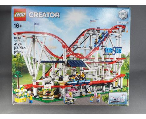 Lego - A boxed Lego Creator 10261 Roller Coaster. The set has been opened, contains its instructions and is unchecked for com