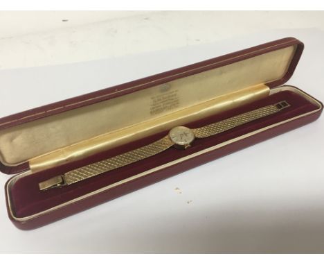 A ladies 9carat gold Garrard watch manual wind in a fitted box. Reserve with personal inscription Total weight 21g. Seen work