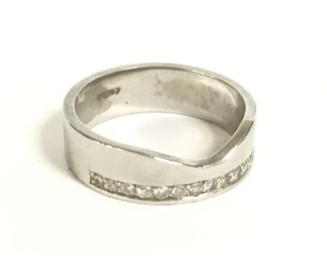 A Platinum wedding band , 6.6g. Size K/L Postage category A