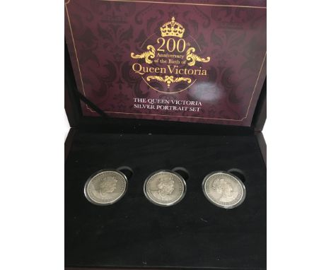 A Queen Victoria silver portrait set, 200th anniversary of the birth of Queen Victoria silver five pound coins. Limited editi