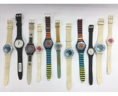 A collection of Swatch watches. Shipping category A.