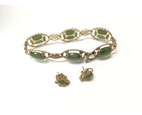A 9ct gold jade set bracelet with a gold plated pair of jade earrings. Approx gold weight 14.4 grams.