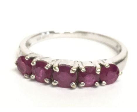 A 9 carat white gold ruby set ring, size N/O. 2.3g Postage category A